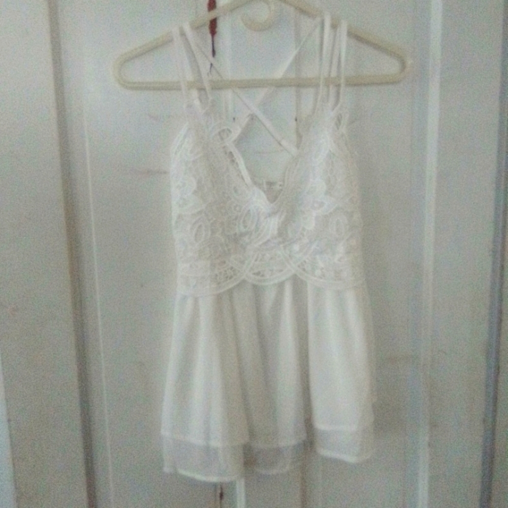 Feager size small lovely lace front top pure white criss cross back.